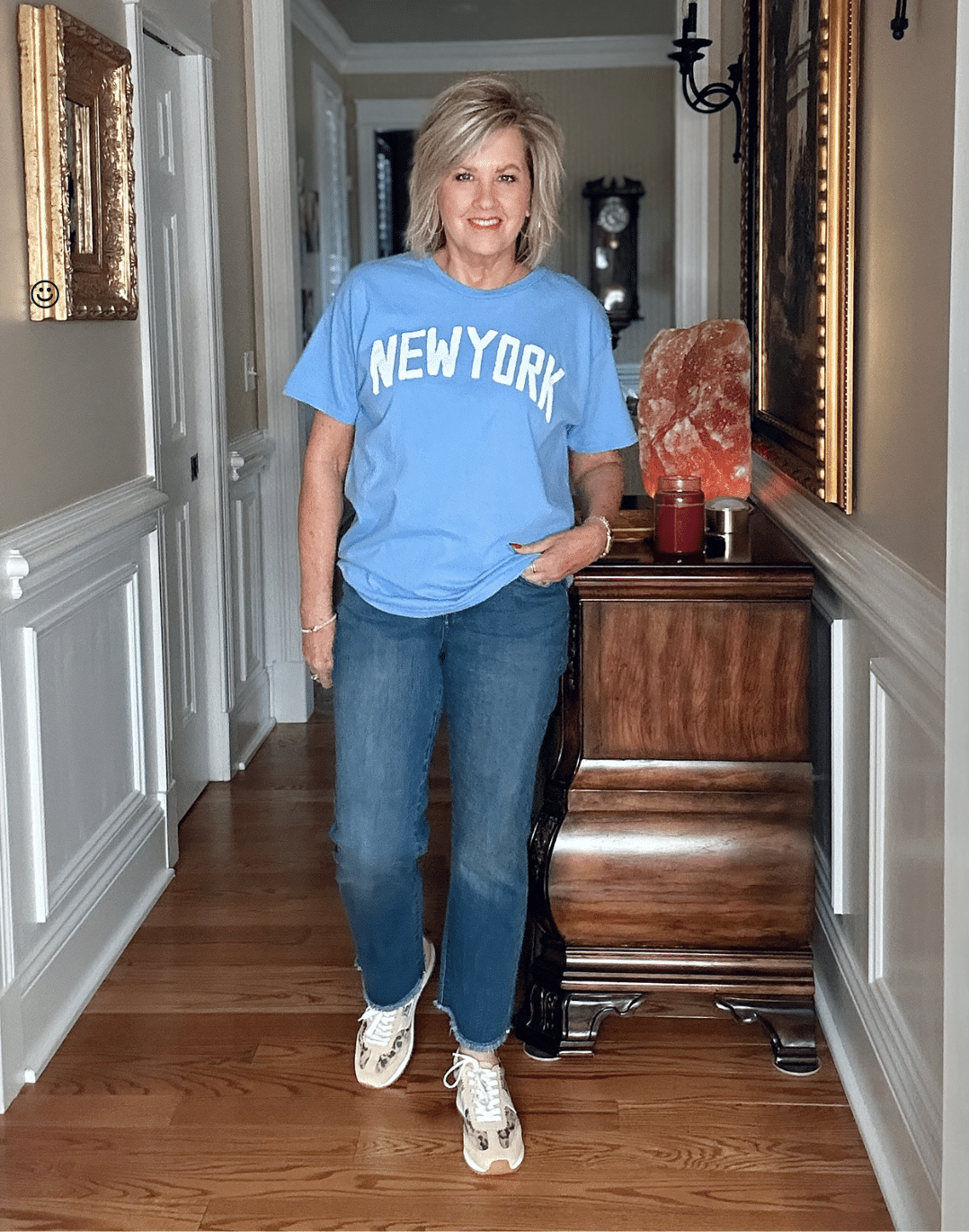 Crop jeans with graphic tee and sneakers – casual styling tip example for over 50 denim wearers.